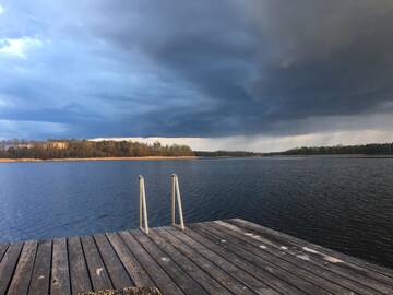 Фото номера Дом с 2 спальнями Дома для отпуска Baublys Lake Lodge г. Viktarinas 8