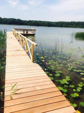 Фото номера Дом с 2 спальнями Дома для отпуска Baublys Lake Lodge г. Viktarinas 37
